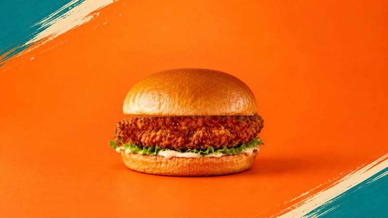 Chicken burger with lettuce and mayo in a brioche bun
